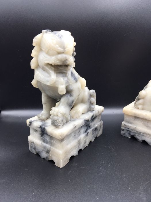 Caes foo orientais em pedra