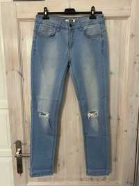 Spodnie jeansy jasne z dziurami na kolanach 38/40 M/L