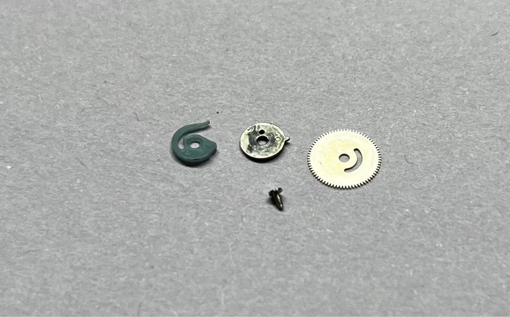 Omega 1020 Seamaster sprężynka zmiany daty z kołem 1571