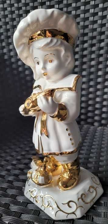 Chłopiec z zabawkami - porcelana - Capodimonte Swarovski Sygnatura