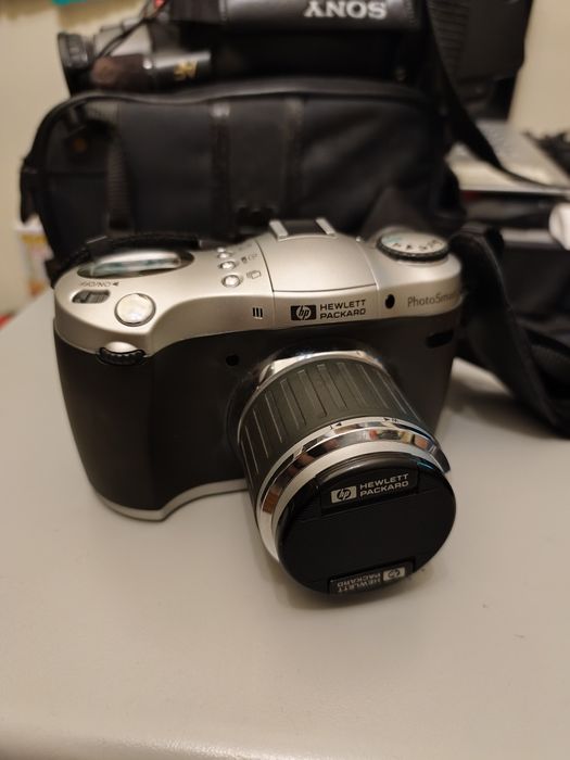 Máquina fotográfica HP Photosmart 912, com flash Toshiba 316