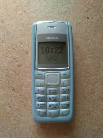 Мобильный телефон Nokia 1112 и гарнитура