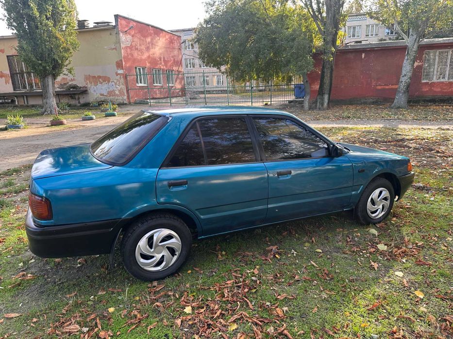 Mazda 323 расход 7л/100км