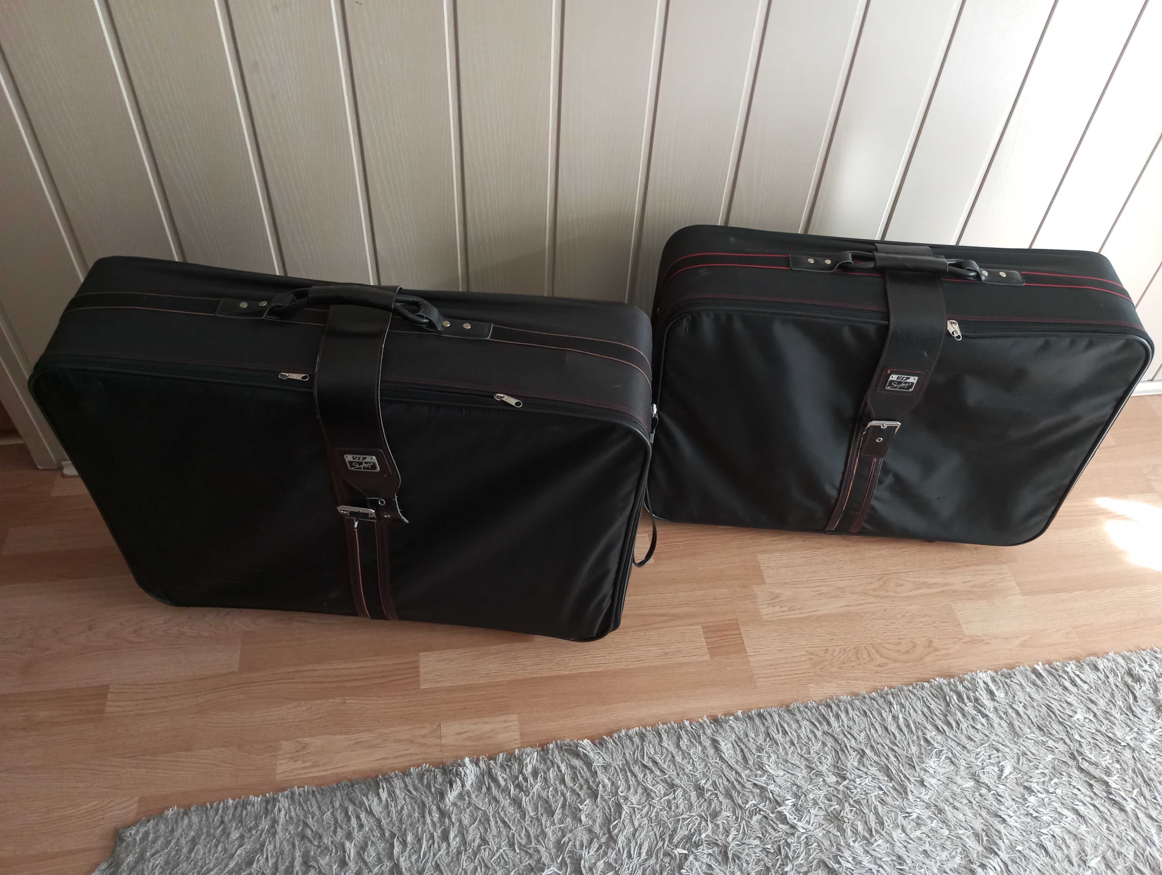 dwie walizki  czarne wymiar około 72x49x19,5  i 75x55x20,5 z kółkami