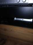 PlayStation 3 z grami, padami i kierownica.