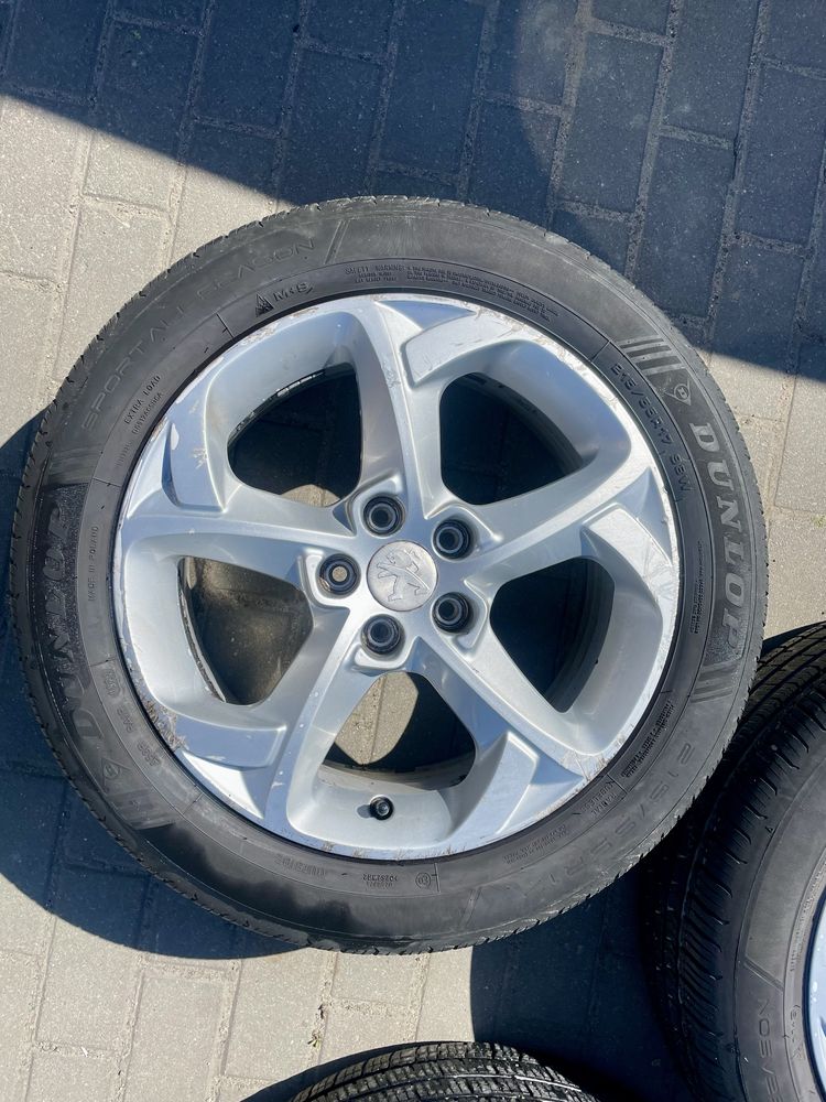 Alufelgi PEUGEOT 5x108 7J ET46 z oponami DUNLOP