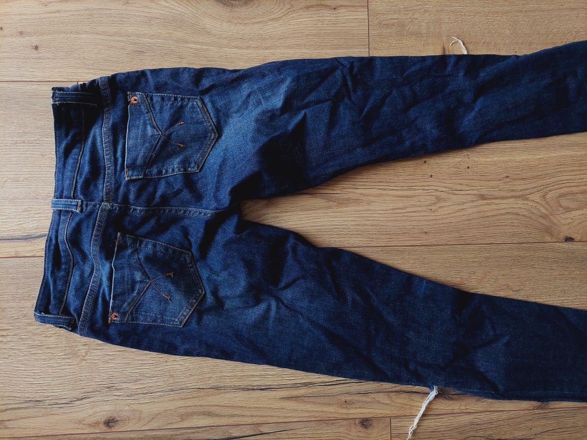 Granatowe spodnie dżinsy z rozdarciami top shop 36