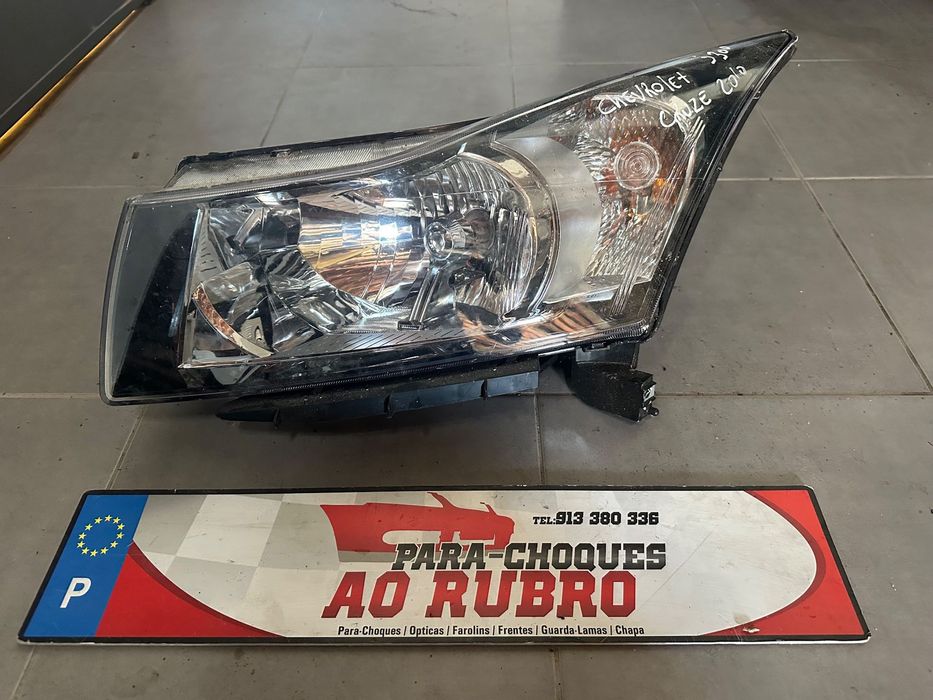 Farol esq chevrolet cruze j300
