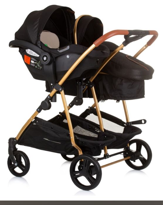Carrinho de gemeos bebé chipolino preto com detalhes em dourado
