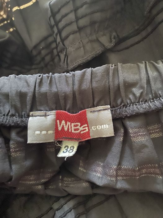 Спідниця темно-шоколадного кольору в золоту смужку