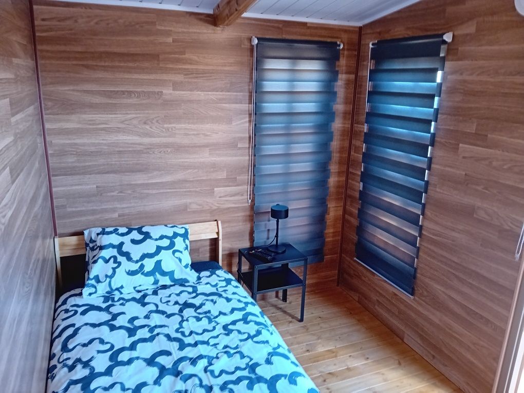 Quarto em casa de madeira