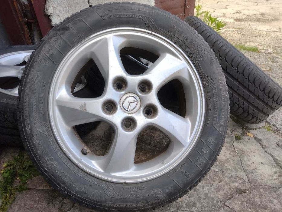 Mazda Felgi 15 cali Alu plus opony letnie 15x6JJ 5x114,3 ET50