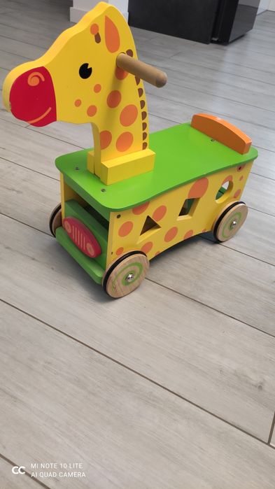 Jeździk drewniany żyrafa sorter pchacz  bigjigs