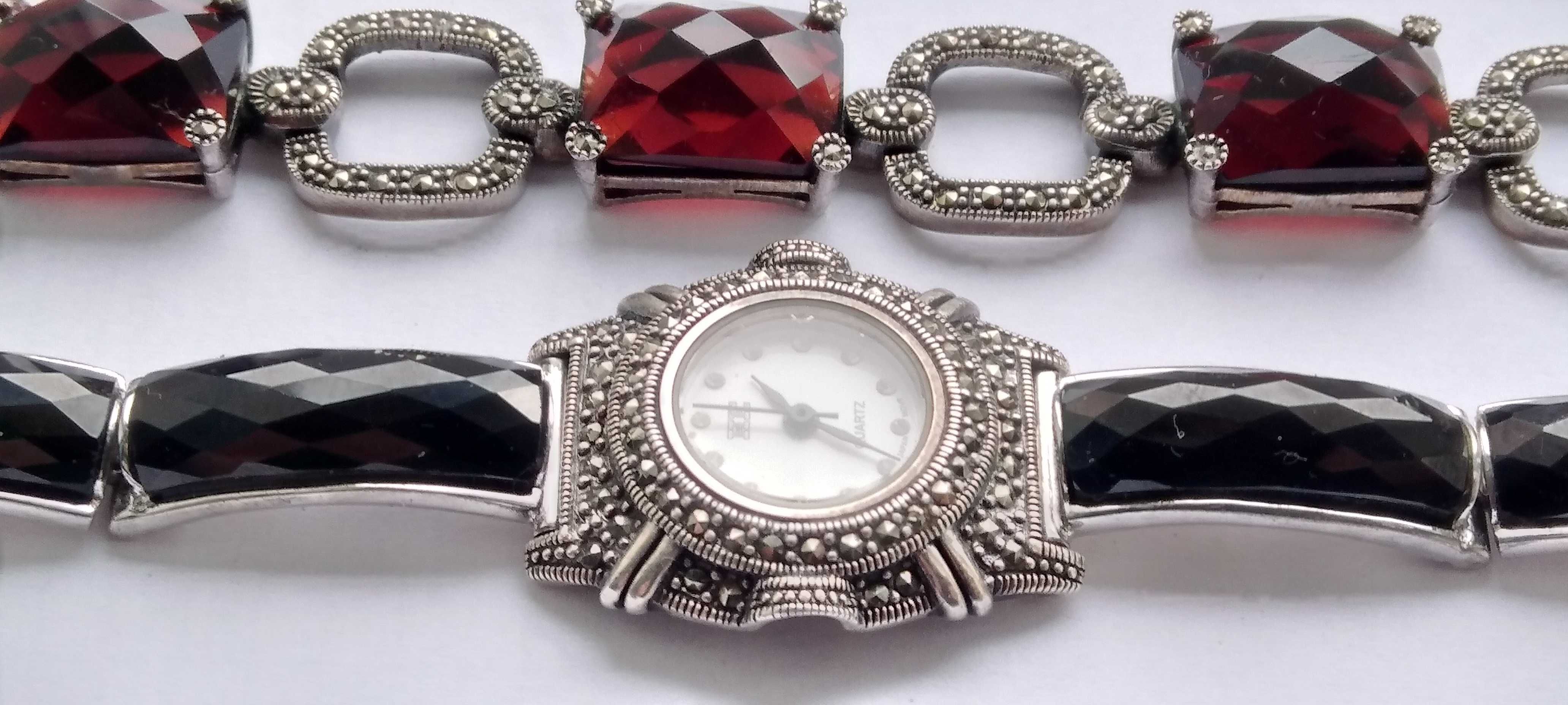 Женские  серебряные часы  и браслет с крупными камнями.