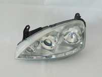 ORYGINAŁ lampa przednia przód lewa soczewka Opel Corsa C FL lift 03-06r EUROPA