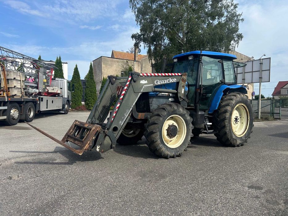 Ciągnik New Holland TM 130 z ładowarką czołową (TUR) - Import z Belgii