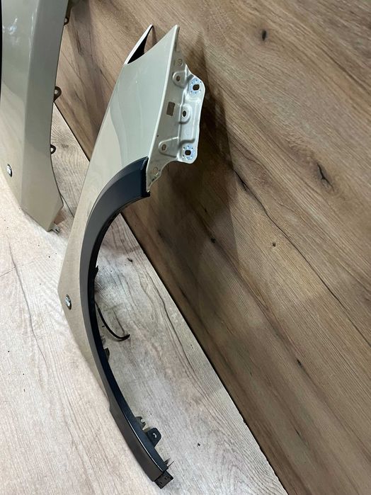 Błotnik przedni lewy prawy Skoda Fabia II Scout kolor 9205