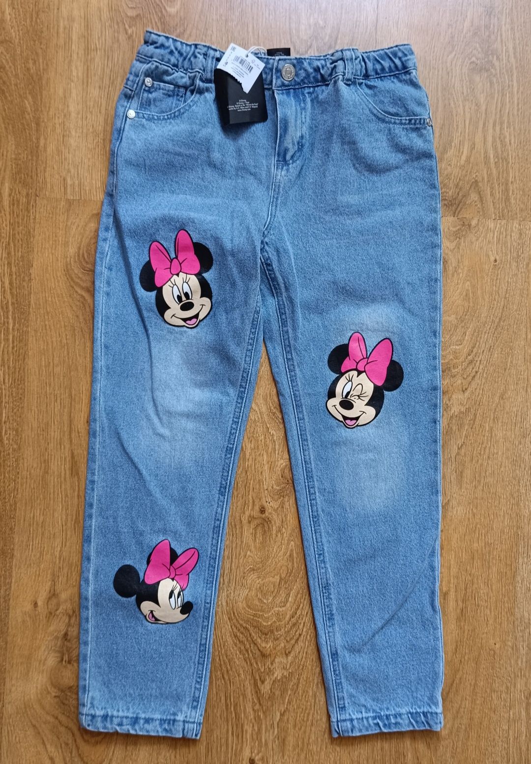 Nowe jeansy Minnie r140