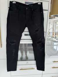 H&M jeansy rurki czarne z dziurami motocyklowe XL