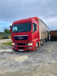 MAN TGX 2011, причіп Schmitz 2005