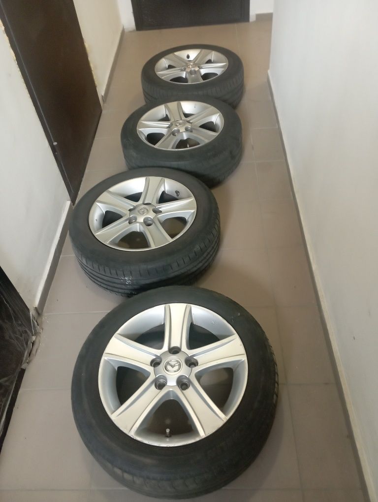 Продам фирменные диски с авто Мазда 16".