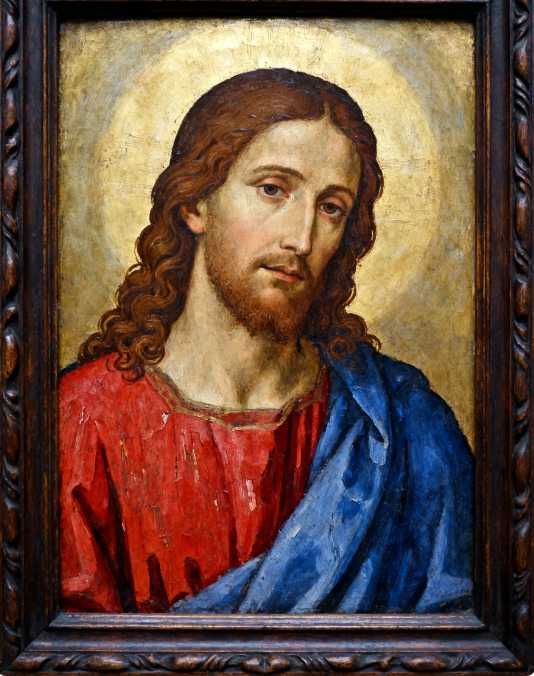 Um pendente personalizado com a imagem de Jesus gravada.