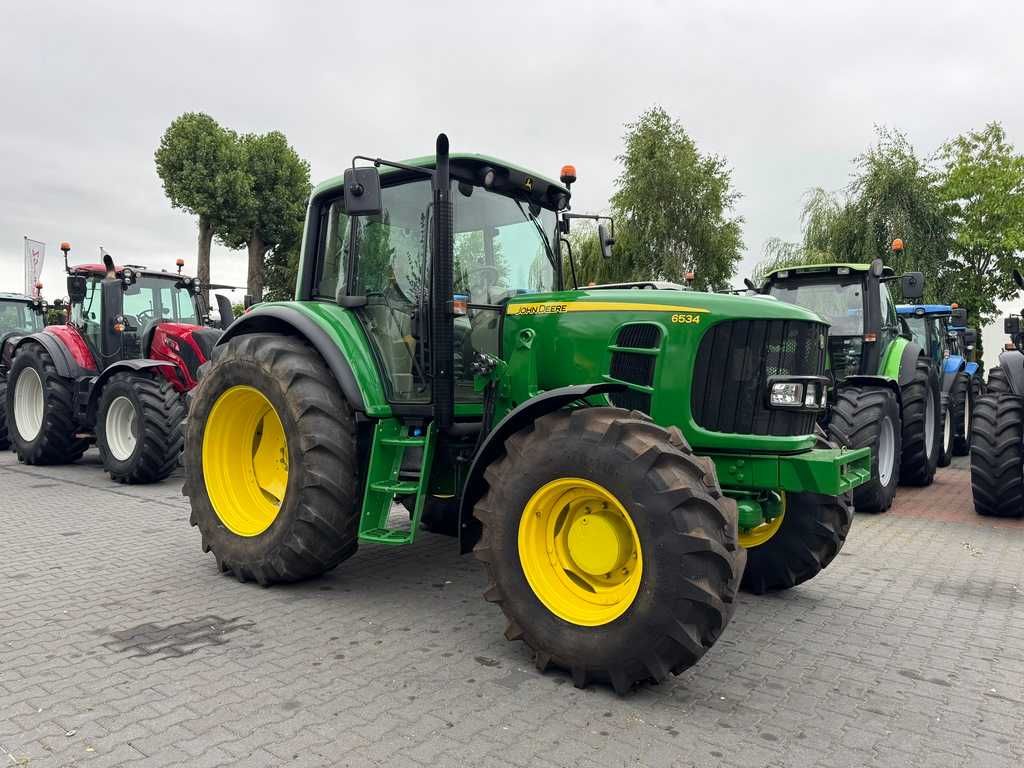 JOHN DEERE 6534 / Przednia oś amortyzowana TLS / PowrQuad Plus /