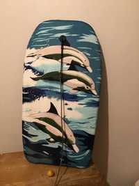 prancha de surf com golfinhos