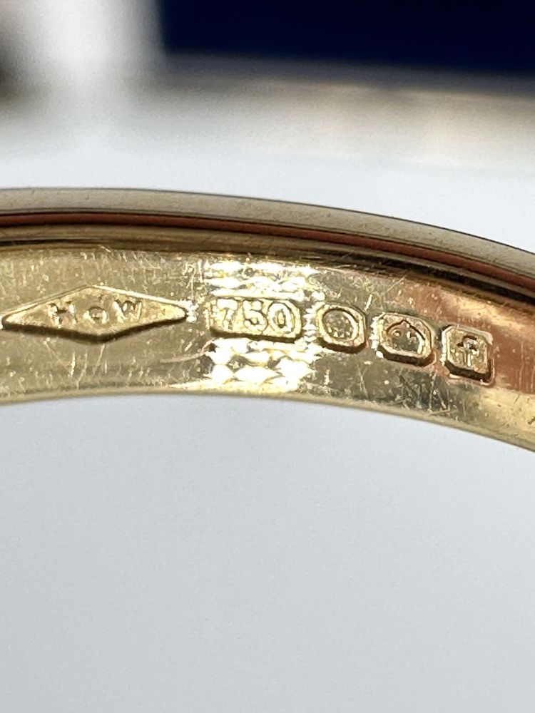 Złoty pierścionek 750 z szafirem 0,30ct i diamentami 0,10ct