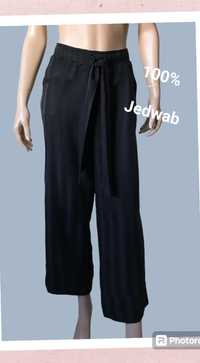 Ganni spodnie jedwabne damskie M
100%jedwab
rozmiar:M 
Kolor:czarne w