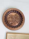 Pratos decorativos em cobre com relevo