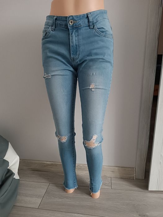 Spodnie damskie jeansy rurki z dziurami L 40