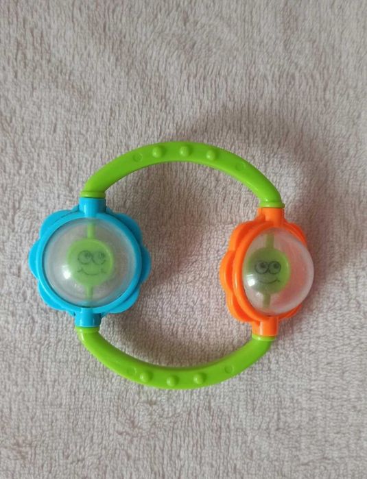 Grzechotka uśmiechnięte buźki