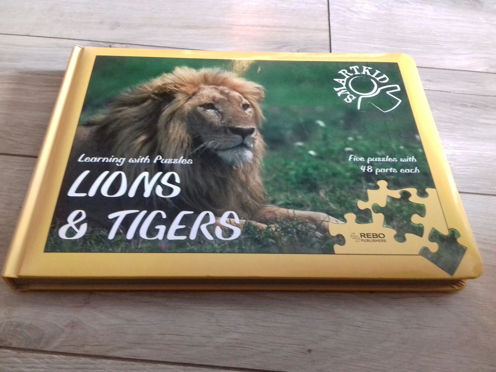 Książka Lions&Tigers z puzzlami 5x48 jak nowa