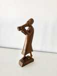 Escultura em madeira - figura com instrumento