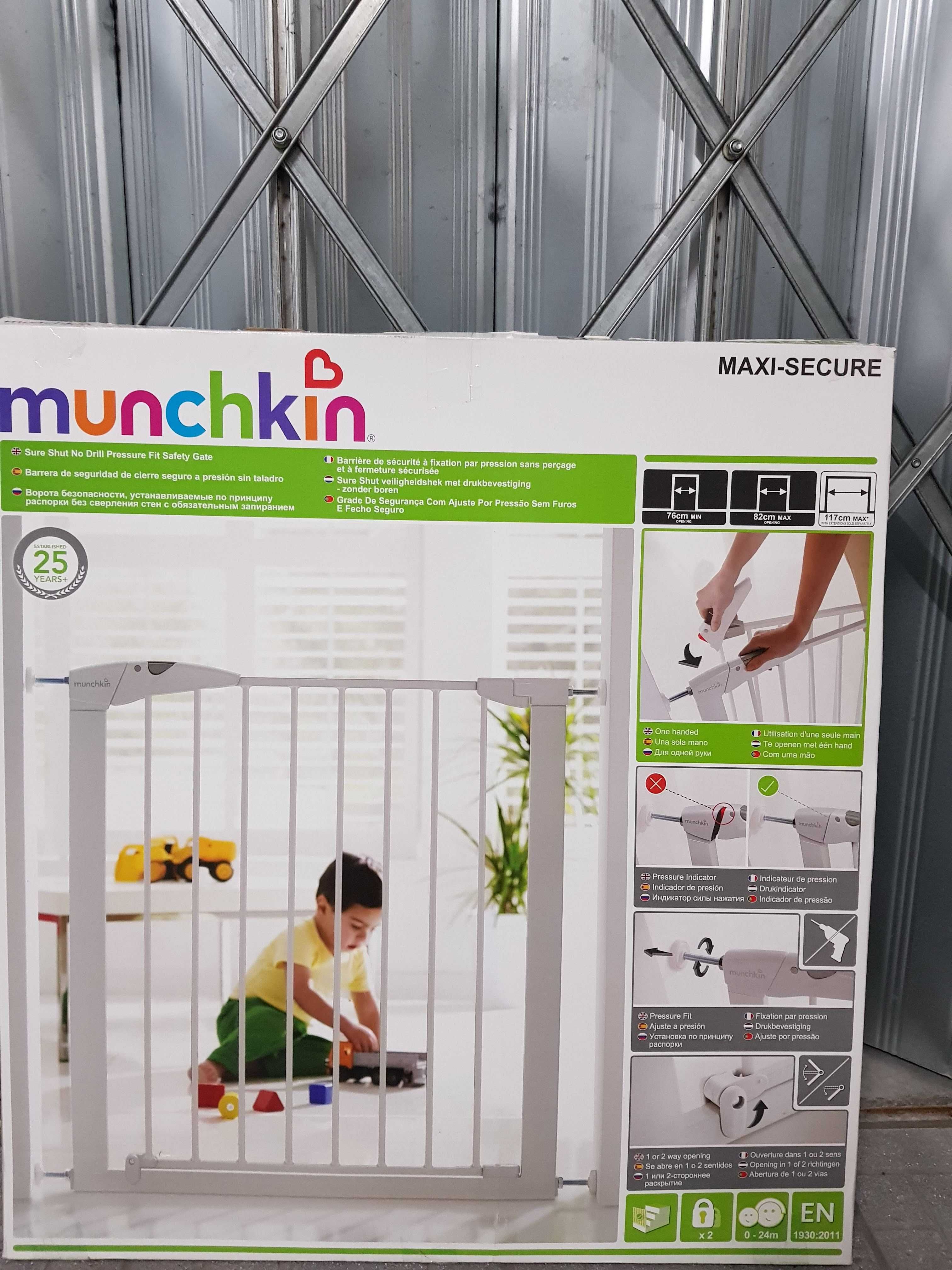 Grade Munchkin para criança e caixa de embalamento.