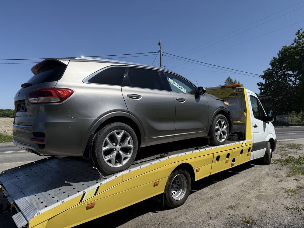 Pomoc drogowa, autolaweta, holowanie, transport aut wózków maszyn