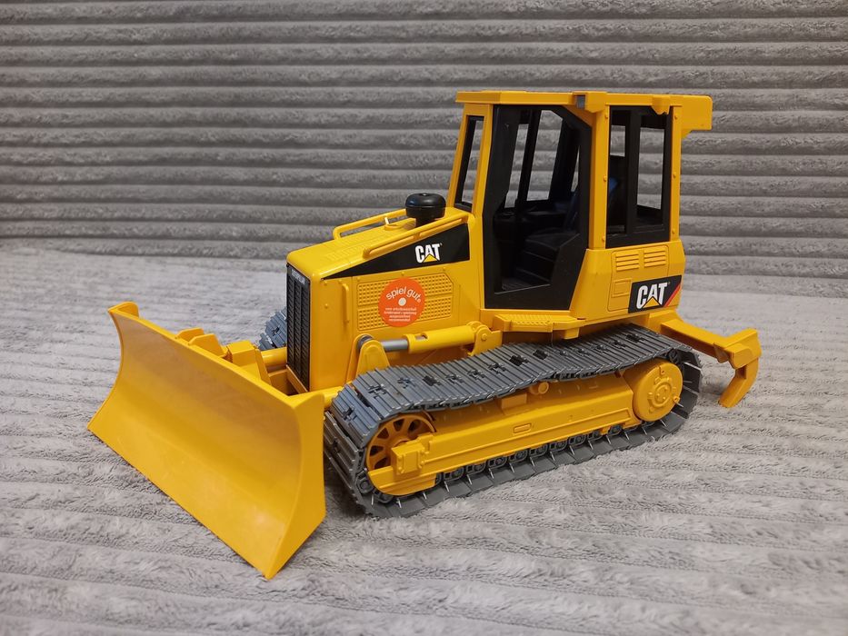 Гусеничний трактор бульдозер CAT від Bruder