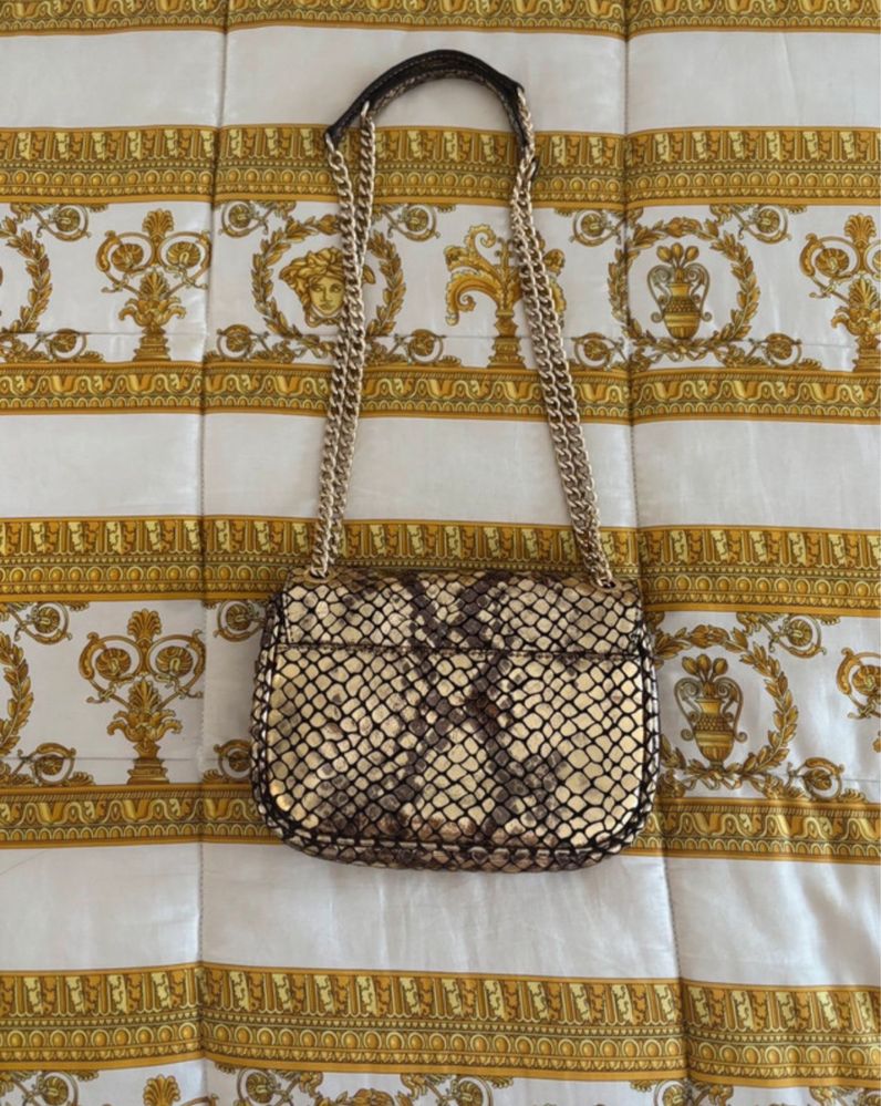 Michael Kors Mala Metallic Gold em Couro