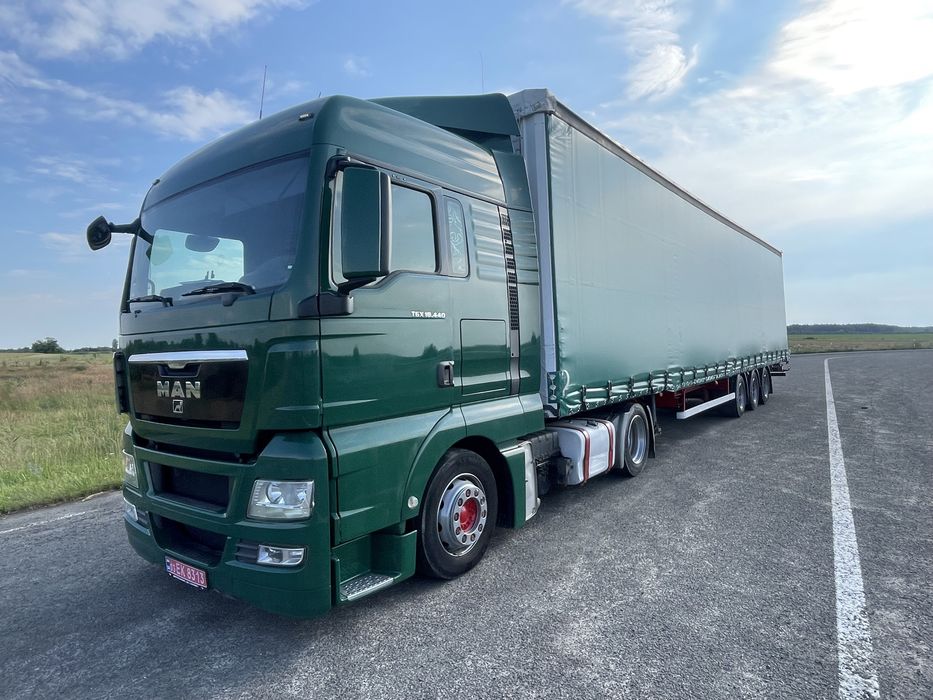 Тягач Man TGX 18.440 MEGA + напівпричіп штора Kassbohrer осі SAF