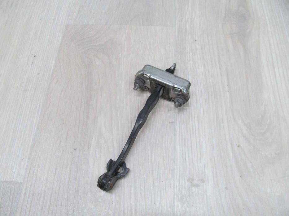 NISSAN CABSTAR MAXITY NT400 OGRANICZNIK DRZWI PRZOD 07-15