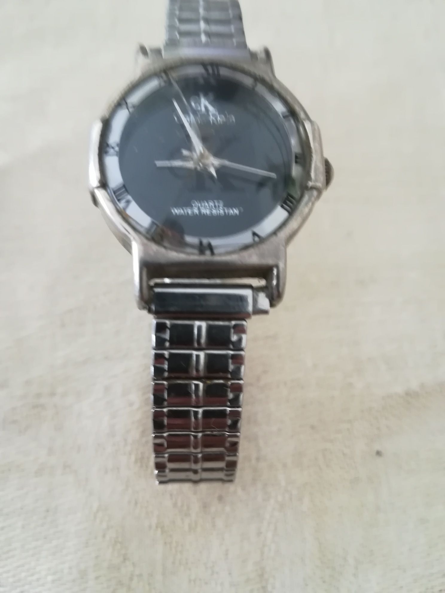 Relógio Calvin Klein e isqueiro Australiano