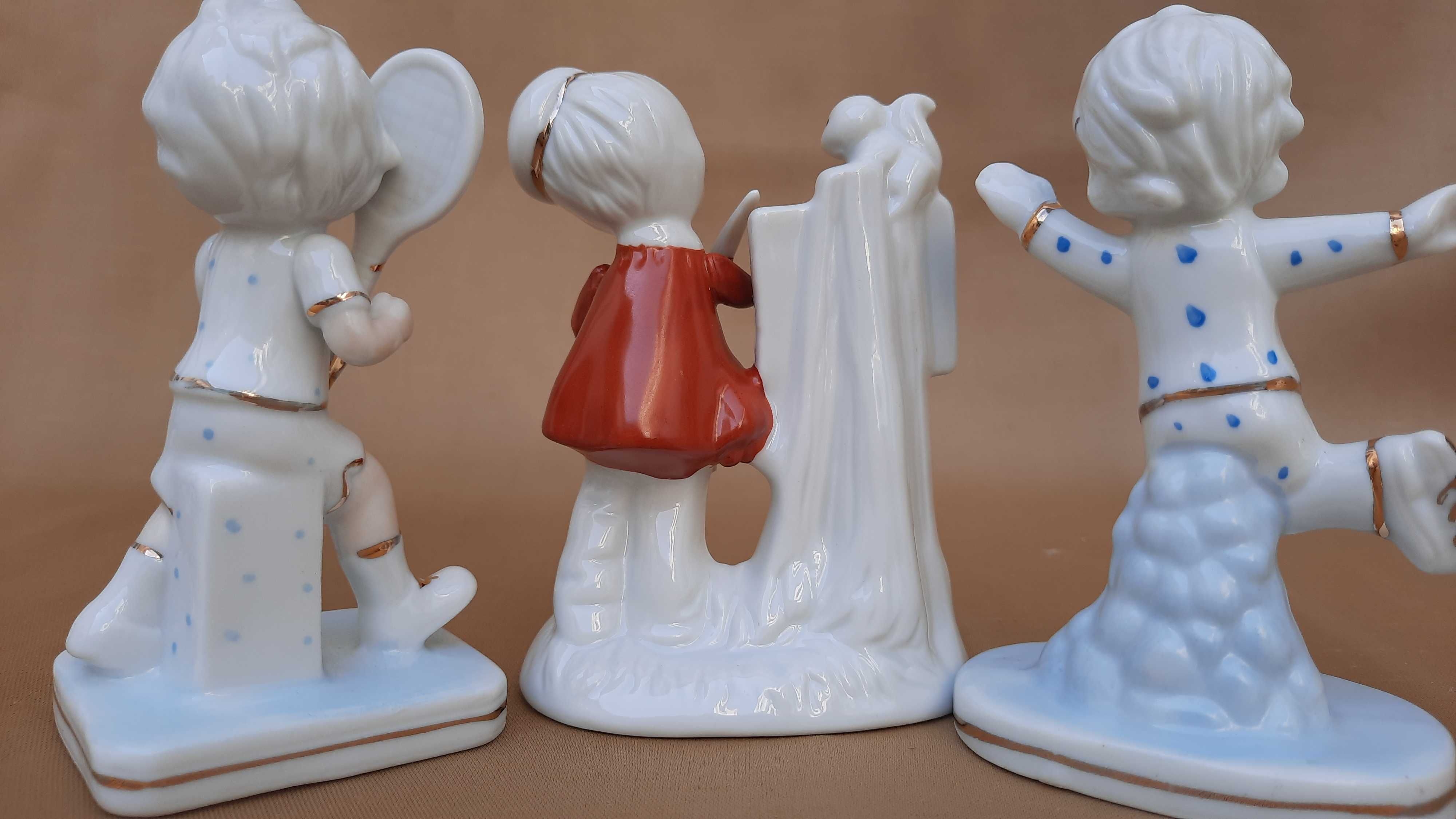 Estatuetas de porcelana de crianças. Congunto.