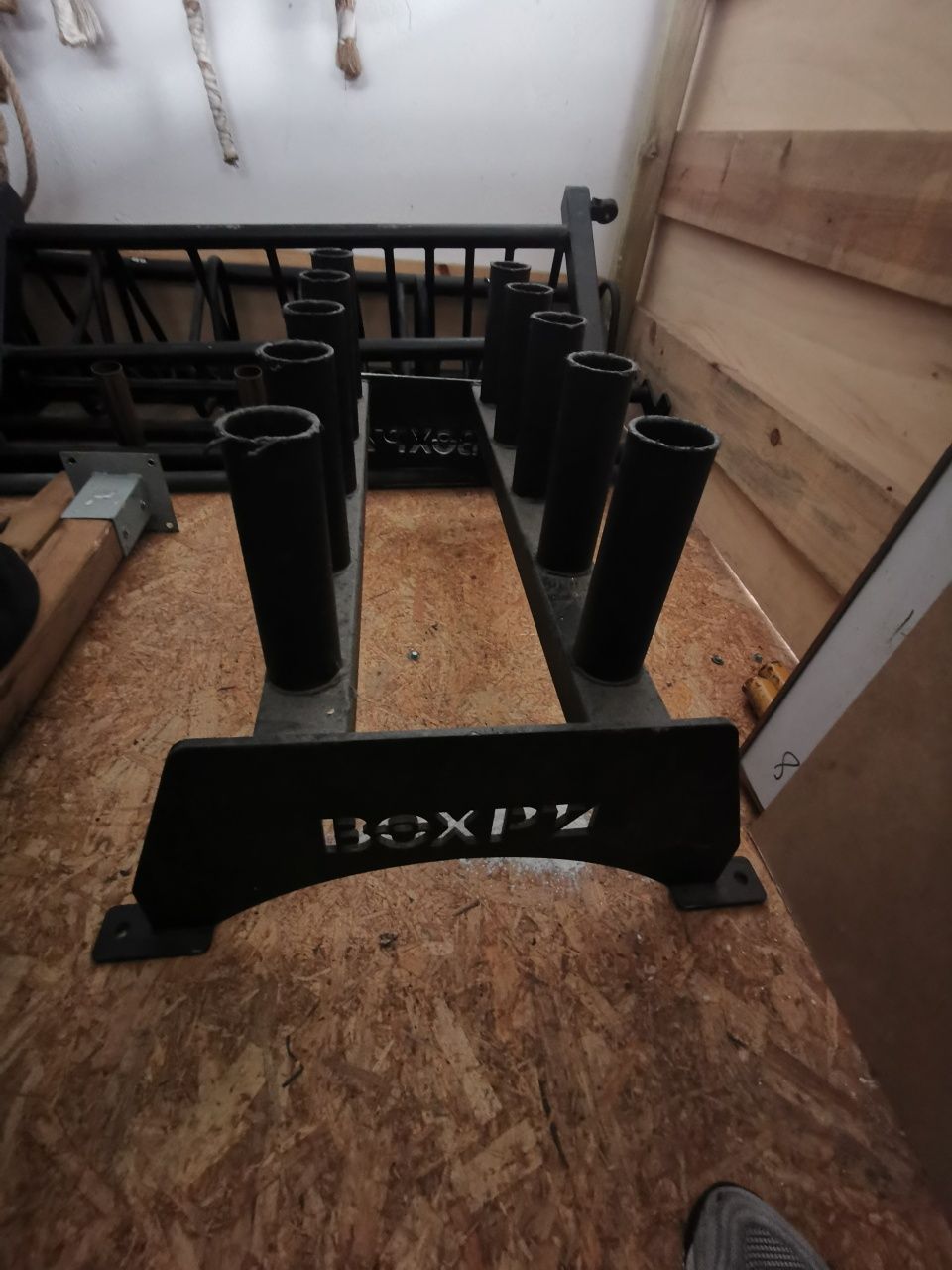 Arrumação vertical para barras olímpicas