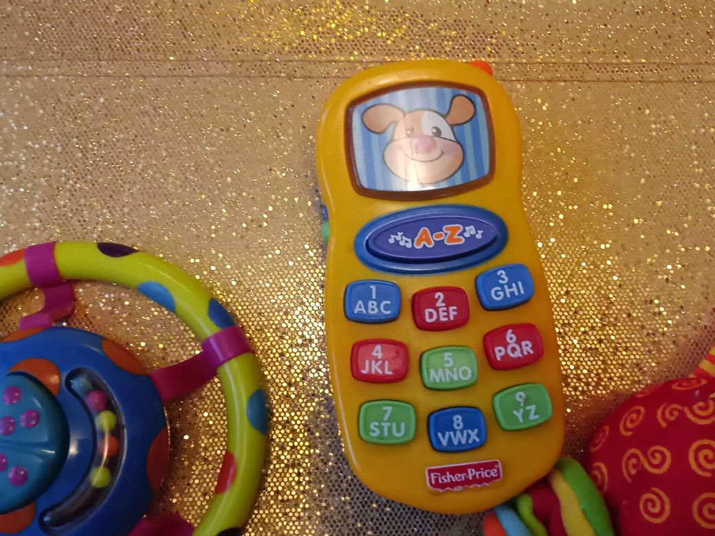 3 Zabawki wibrująca zawieszka grzechotka Tinylove telefon Fisher price