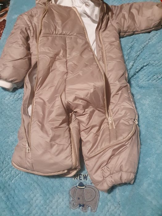 Продам бежевый комбинезонезон унисекс