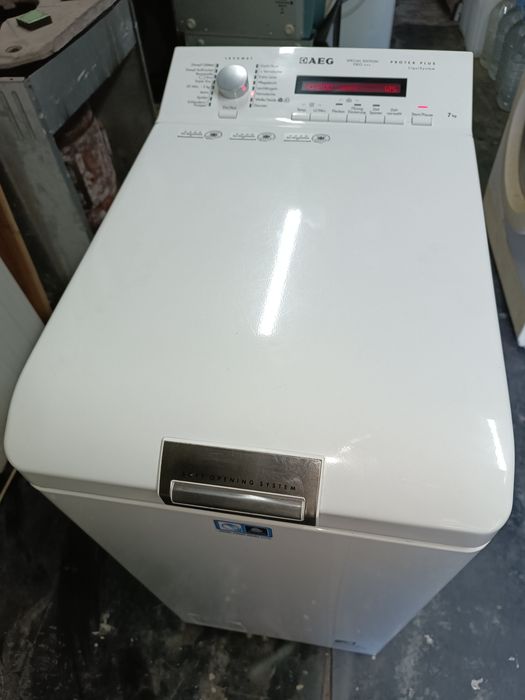 Вертикальна пральна машина AEG 7кг/1200об.хв Гарантія