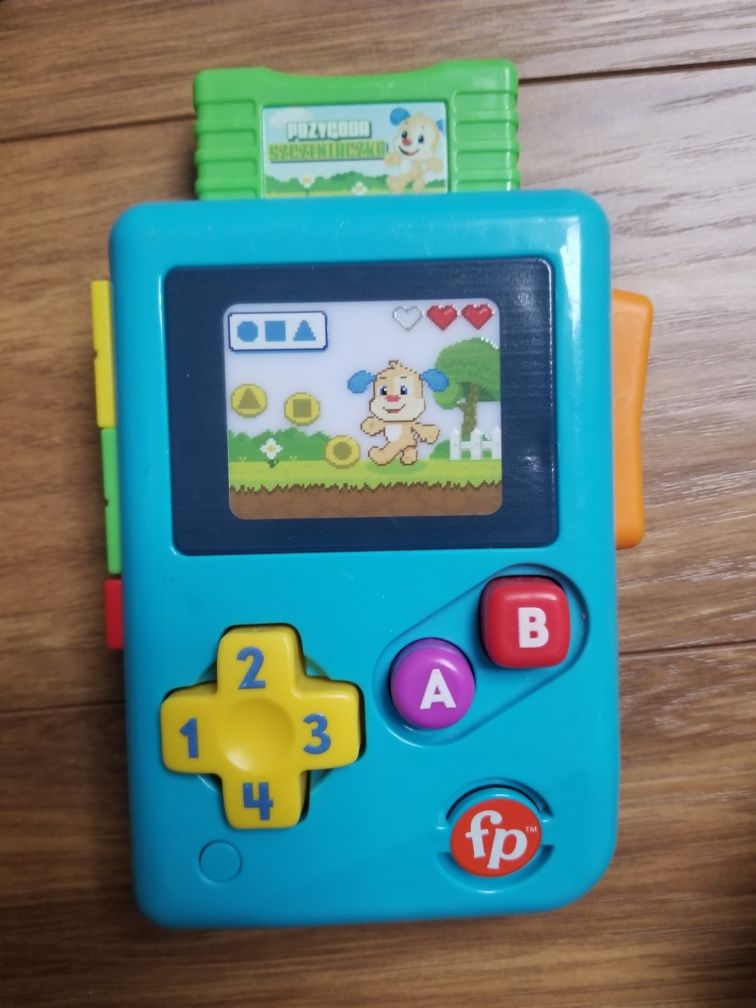 Zabawki interaktywne fisher price konsola zegarek clementoni bajka 6m+