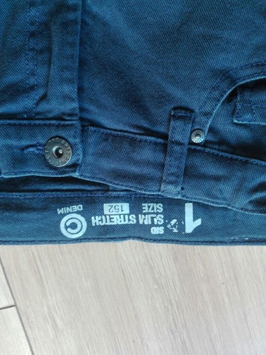 Spodnie chłopięce granatowe. R - 152