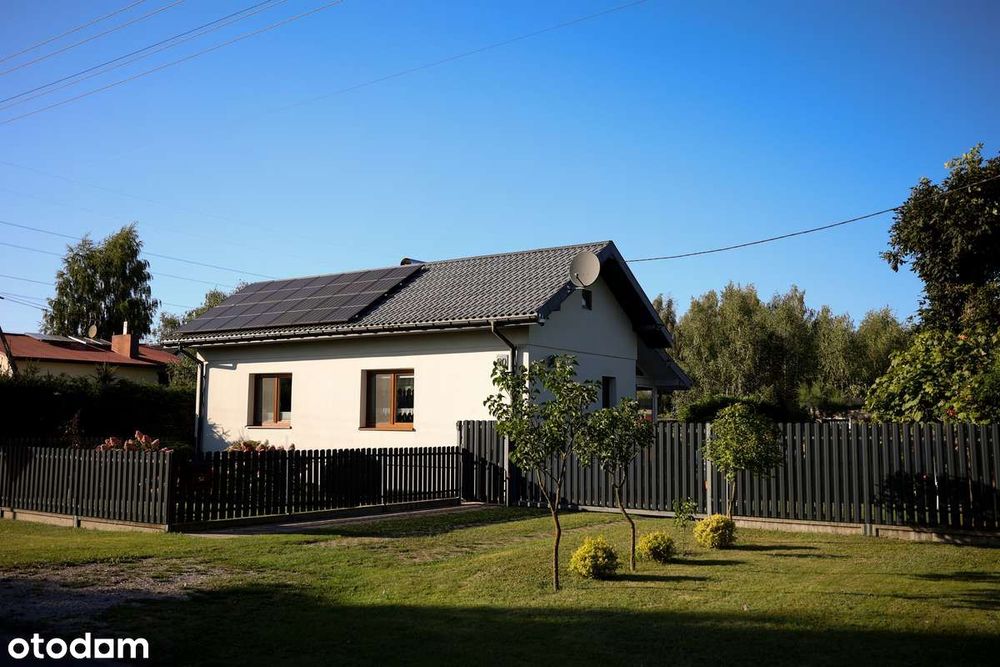 Dom z potencjałem – 100 m², staw, ogród zimowy, 2 garaże, blisko Łodzi